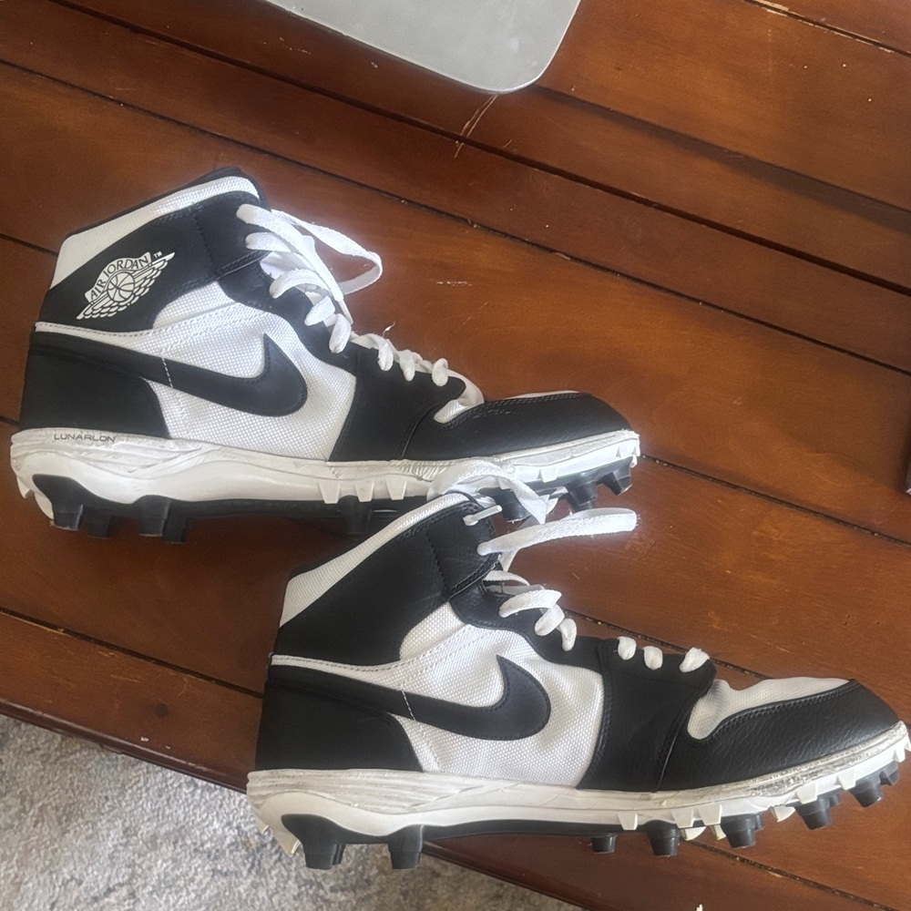 Nike Air Jordan Lunarlon Black and White High-Top Football Cleats.